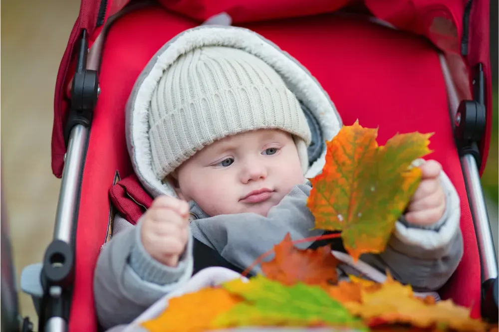 when can baby sit in stroller