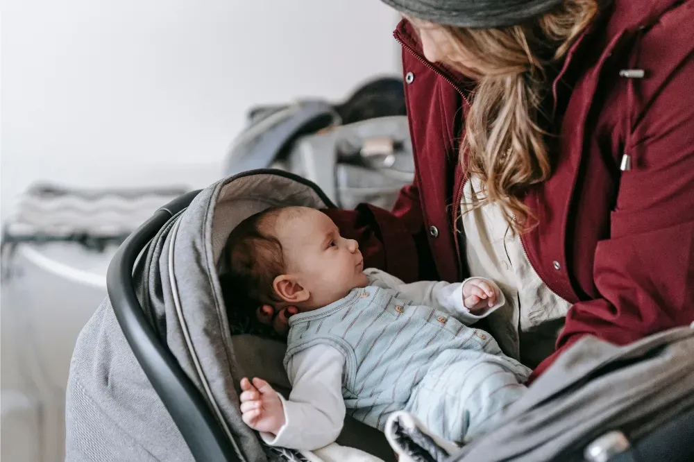 when can baby sit in stroller