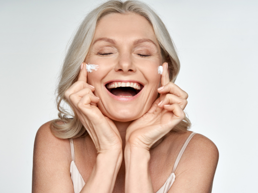 A woman with sensitive skin applying a retinol cream