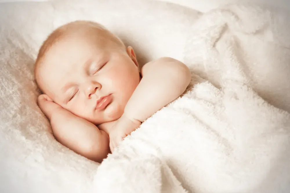 how to train newborn to sleep in bassinet