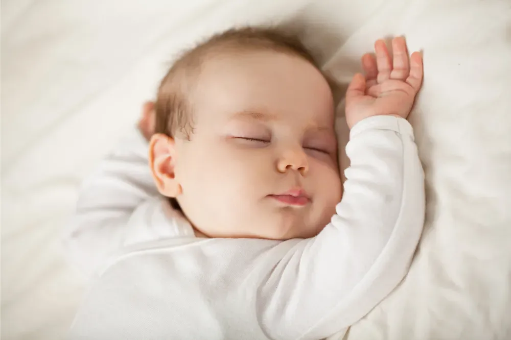 how to get newborn to sleep in bassinet