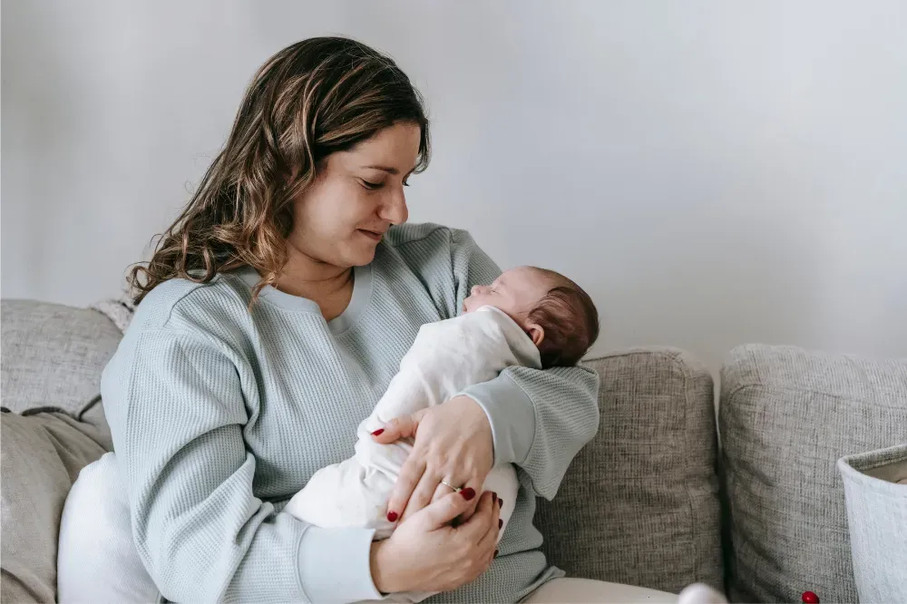 how to get newborn to sleep in bassinet